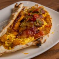 Breakfast Taco · Scrambled eggs, crispy Marigold hash browns, cheddar cheese and your choice of chile served ...