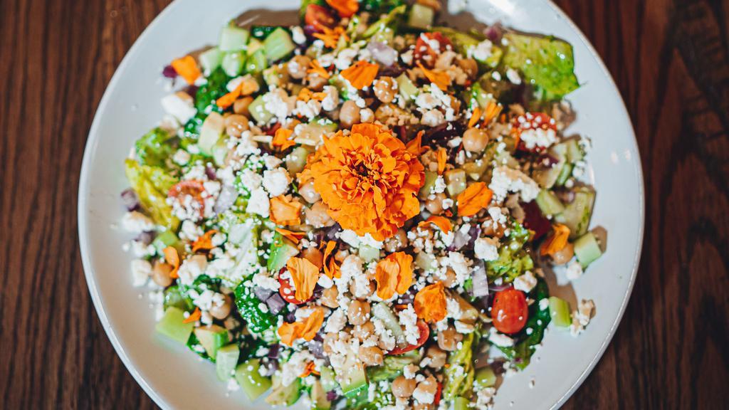 Marigold Salad · This gourmet salad contains sliced avocado, cucumber, cherry tomatoes, red onion, garbanzo beans, and feta cheese all on top of romaine lettuce, tossed with a cilantro pesto dressing. Add grilled chicken or bacon for an additional charge.