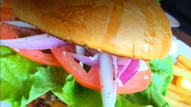 Beyond Burger · Vegetarian. We serve an all vegetarian Beyond burger patty with cheddar cheese, lettuce, tomato, red onion, pickles and our signature sauce. Add green chile for an additional charge.