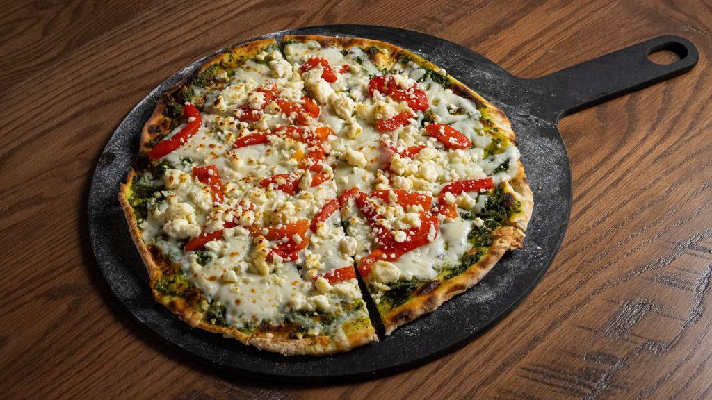 Pesto Flatbread · Naan topped with our homemade pesto sauce, mozzarella cheese, roasted red peppers, and feta cheese.