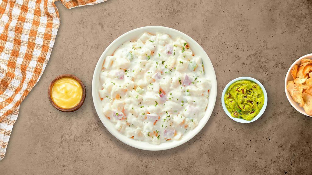 Potato Salad · (Vegetarian) Diced potatoes dressed in mayonnaise and yellow mustard, and mixed with celery seed, hard-boiled eggs, celery, and onion.