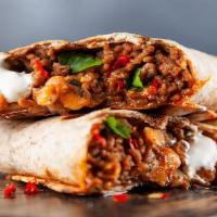 Shredded Beef Barbacoa Burrito · A burrito filled with shredded beef barbacoa, pico de gallo, rice, beans, lettuce, tomatoes,...