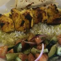 Chicken Shish Kabob · 6 pieces of chicken tenderloin.  Comes with saffron rice, mixed greens, onions,  and homemad...