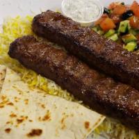 Ground Beef Kabob · Comes with saffron rice, mixed greens, onions,  and homemade bread.