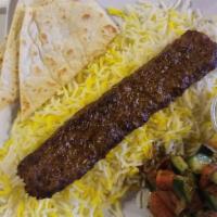 Ground Lamb Kabob · Comes with saffron rice, mixed greens, onions,  and homemade bread.