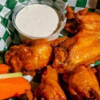 Chicken Wings · All natural wings tossed in your choice of buffalo or whiskey BBQ sauce.