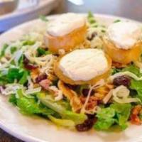 Salade De Chevre Chaud Half · Romaine lettuce, topped with walnuts, bacon, cranberries, and swiss cheese. Served with  sli...