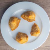 Khazana Vegetable Samosa  · Light crisp pastry filled with potatoes and mixed
vegetables