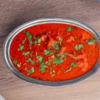 Chicken Tikka Masala · Boneless chicken simmered with onions, herbs and green peppers in a mild sauce.