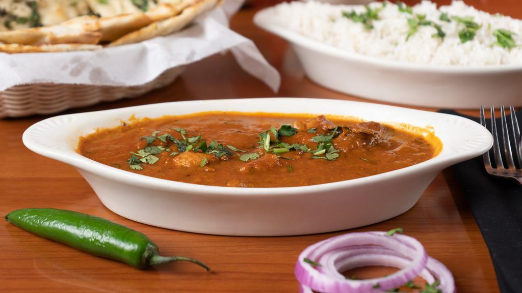 Chicken Tikka Masala · Chunks of chicken in clay oven and then cooked in a light creamy sauce with bell peppers and onions.