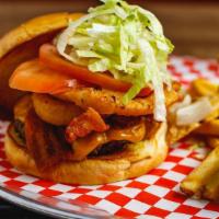 Spicy Western Burger · cheddar cheese, thick cut bacon, cheddar cheese, onion rings, jalapeno, lettuce, tomato,  BB...