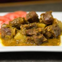 Curry Goat · Tender organic goat meat stewed in our house blend curries.