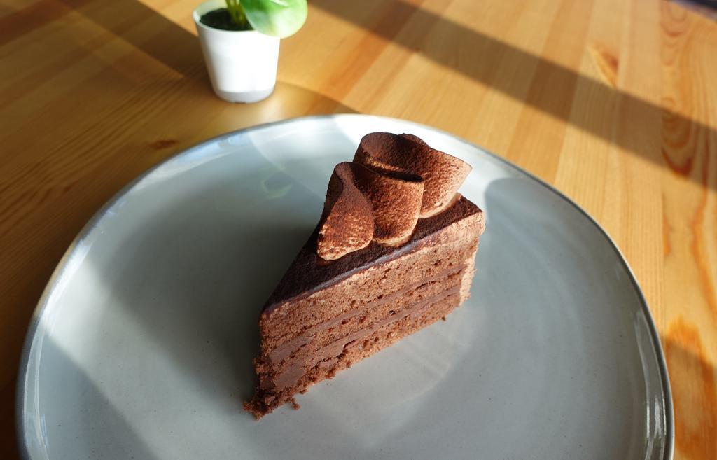 Chocolate Cake Slice · Chocolate chiffon cake with chocolate ganache filling and chocolate mousse frosting.