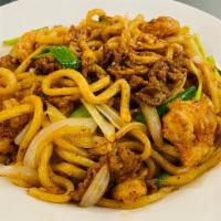 Combination Udon  · Chicken, beef, and shrimp stir-fried with udon noodles, bell peppers, and onions, mixed with...