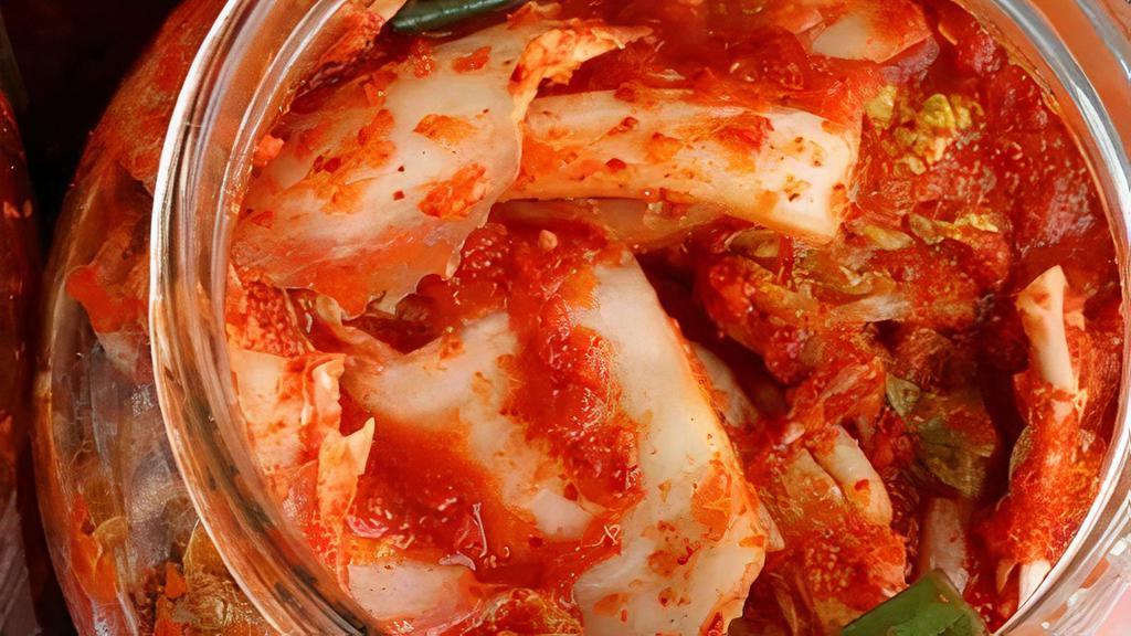 Kimchi (Bottle) · Spicy. Fermented cabbage and vegetables mixed with spices.