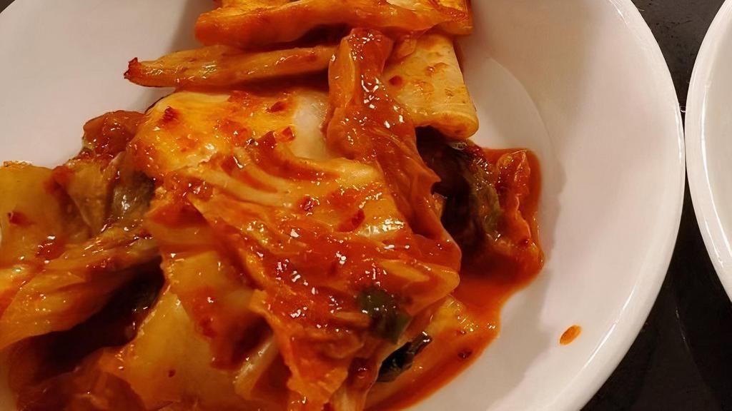 Kimchi · Spicy. Fermented cabbage and vegetables mixed with spices.