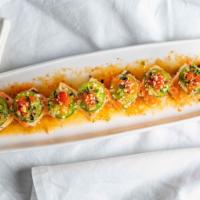 Playgirl Roll · Fresh salmon, jalapeno, masago on spicy crab.