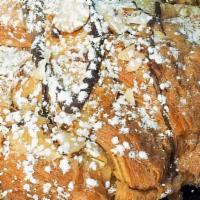 Chocolate Almond Croissant · Flaky Puff Pastry |  Almonds Slices | Cream Filling | Dark Chocolate | Powdered Sugar