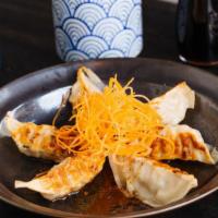 Gyoza · Steamed pork and vegetables pot stickers.