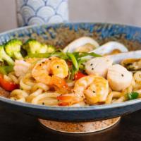 Nabeyaki Udon (Dinner) · Soup udon noodles with prawn tempura, chicken, egg, and vegetables.