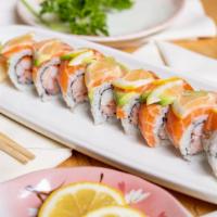 Sun Flower Roll · Snow crab and tobiko topped with avocado, salmon, and slice lemon.