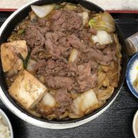 Sukiyaki (Dinner) · Traditional dish of thinly sliced beef cooked in a broth with vegetables. Served with kobach...