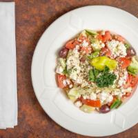 Greek Horiatiki Salad · Tomatoes, green peppers, onions, cucumbers, feta, olive and pepper.
