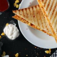 Classic Grilled Cheese · American cheese on buttery white or wheat bread.