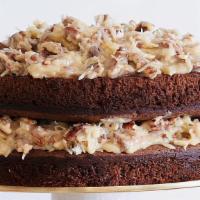 Xl German Chocolate Cake  · Chocolate cake with Carmel coconut pecan frosting. Serves two people.
