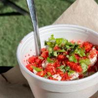 Elote Bowl · Grilled sweet corn, mayo, Cotija cheese, Flamin Hot Cheetos dust, cilantro, pickled onions.