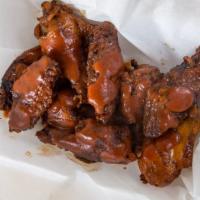 Hot Winger · Six of bob’s pit smoked barbecue wings, bag of chips, bread and a 12oz can of soda.