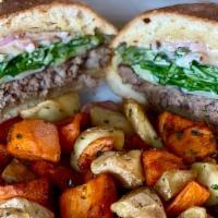 Zulu Burger · Grass fed Angus beef burger topped with Muenster cheese, arugula, pickled shallots and bacon...