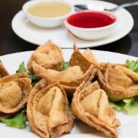 House Wontons · Eight pieces. Deep-fried Chinese pastry, spice-infused ground pork, and Napa cabbage.