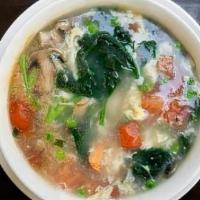 Dragons In The Garden Soup · 32 oz. shrimp, diced tomato, mushroom, spinach, and house broth finished with whipped eggs.