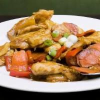 Clay Pot Curry Chicken · Chicken breast, red bell peppers, onions, carrots, and house blend curry spices. Served sizz...