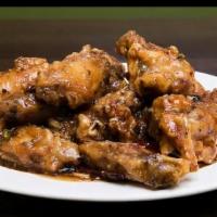 Spicy Dry Fried Chicken Wings · Spicy. 10 pieces battered wings, minced garlic, ginger, chili pods, and dry fry sauce.