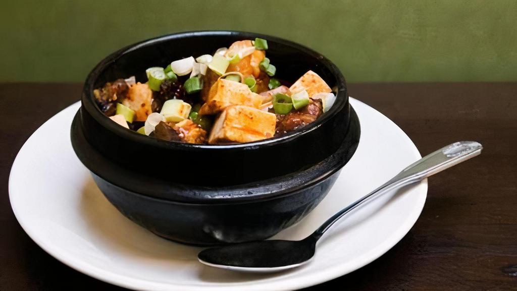 Pork Belly Ma Po Tofu · Spicy. Braised pork belly, steamed tofu, peas, white mushrooms, and spicy Sichuan bean sauce. Served with sizzling in a hot clay pot.