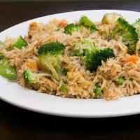 Northern Style Fried Rice · Traditional soy sauce-based fried rice, peas, carrots, and egg. Your choice of one protein.
