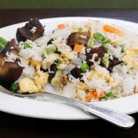 Pork Belly Fried Rice · Braised pork belly, jalapeño, peas, carrots, shredded lettuce, and egg.