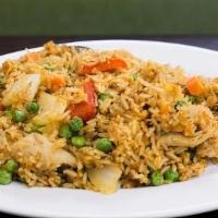 Curry Chicken Fried Rice · Chicken breast, red bell peppers, white onion, peas, carrots, egg, and house-blend curry spi...