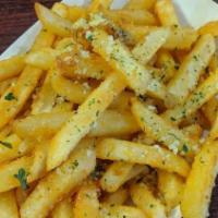 Garlic Parmesan Fries · Topped with garlic sauce and garlic parm.