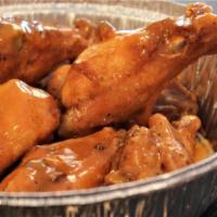 Wings* · Fried chicken wings seasoned with our own blend of spices and tossed in your choice of sauce...