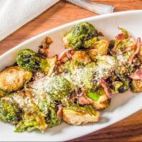 Pan Browned Brussel Sprouts · Basil butter, applewood smoked bacon, topped with Parmesan cheese.