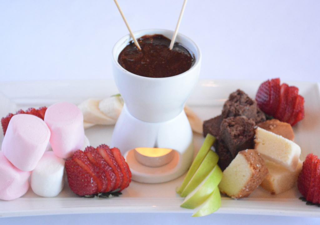 Fondue For Two · Chocolate fondue served with pound cake, fresh fruit, marshmallows, and brownie bites