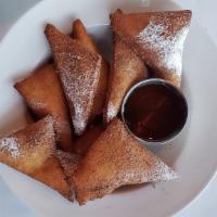 Sopapilla Basket · Fried pastry coated with cinnamon and sugar and served with a honey dipping sauce