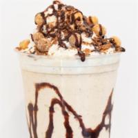 Match Made In Heaven Shake · Vanilla Ice Cream, Butterfinger, Reeses Puffs, Cookie Crisp, Milk, and Chocolate Syrup. Topp...