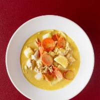 Yellow Curry · Mild yellow curry in coconut milk with potatoes, yellow onions and carrots. Includes steamed...