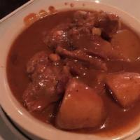 Massaman Curry · Popular. Medium-spicy curry in coconut milk with potatoes, onions and carrots. Topped with p...