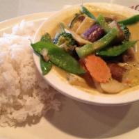 Green Curry · Medium green curry in coconut milk with bell peppers, bamboo shoot, green peas, zucchini and...
