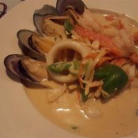 Red Curry · Medium red curry in coconut milk with bamboo shoot, bell peppers, zucchini and Thai basil. I...